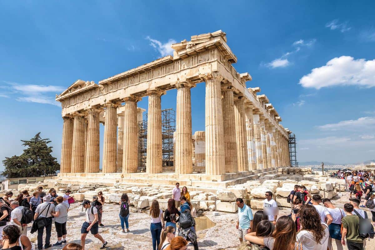 Visitors with Acropolis tickets in front of the Parthenon on a sunny day in Athens